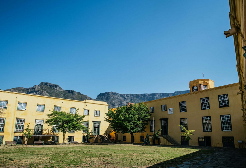 Layout or view of the inner courtyard at the Castle of Good Hope, Cape Town, yellow-painted walls, and pentagonal fortress design